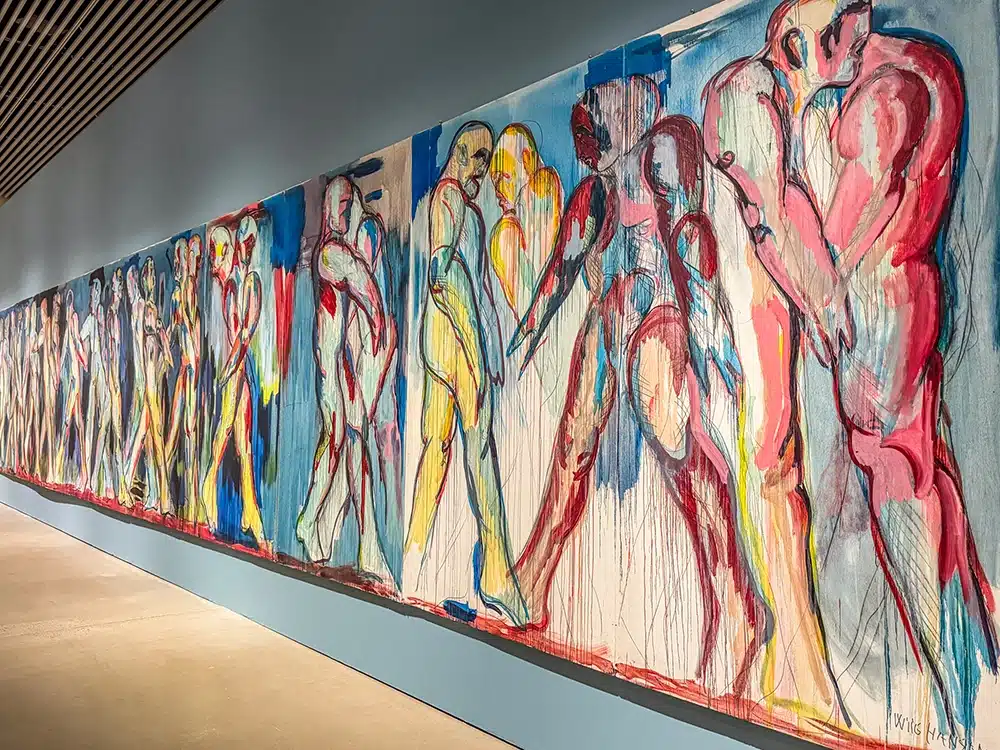 Long mural with naked human figures in blue and red shades, Svend Wiig Hansen at ARoS