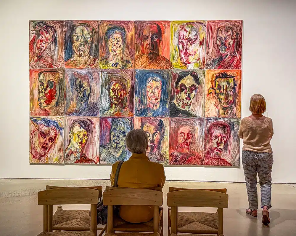 The work Man First with eighteen colorful portraits, Svend Wiig Hansen at ARoS